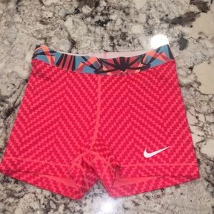 Multi colored red and pink Nike Pros (small)